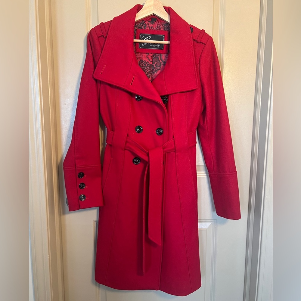 High quality, thick, double breasted pea coat with extra button. Only worn twice